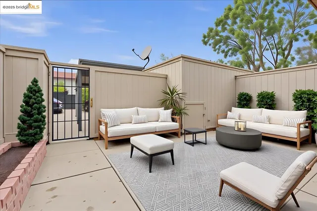 a outdoor living space with furniture and garden view
