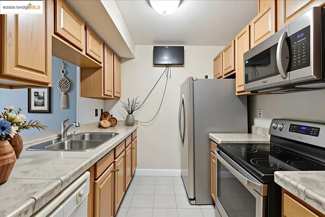 a kitchen that has a sink and a stove