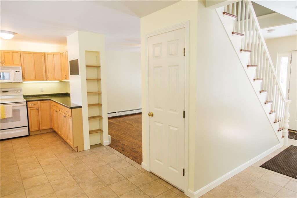 546 North Barnstead Road Barnstead, NH 03225 - Photo 8 of 34 The tiled kitchen has a door to the...