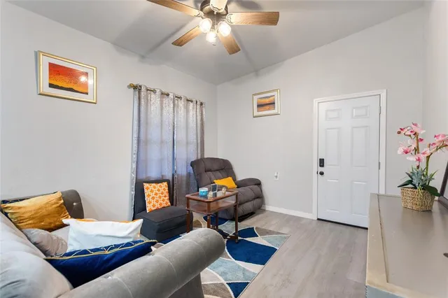 a bedroom with furniture and wooden floor