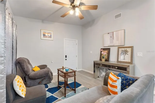 a living room with furniture and a window