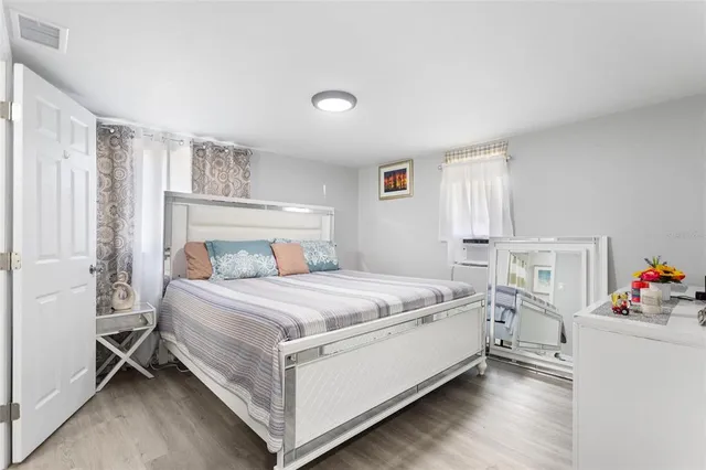 a bed room with a bed and a window