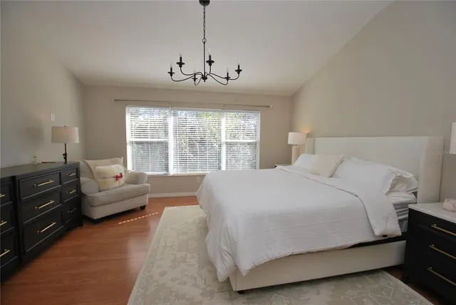 a view of a house with swimming pool and sitting area