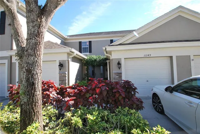 a kitchen with stainless steel appliances kitchen island granite countertop a refrigerator stove and oven