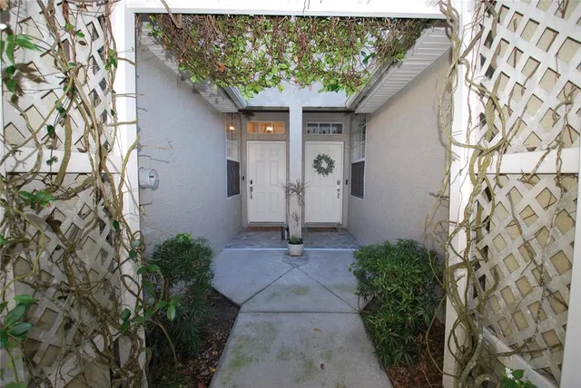 a kitchen with stainless steel appliances granite countertop a refrigerator sink and white cabinets