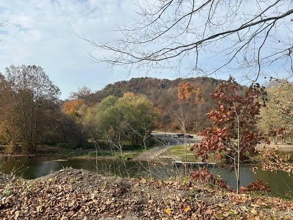 a view of lake with green space