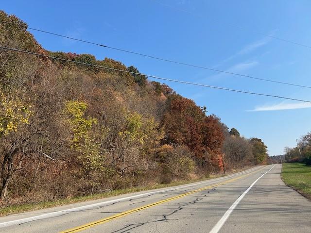 O Midland Road Midland, PA 15059 - Photo 4 of 10 a view of a dry yard with wooden fence