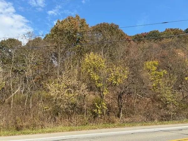 a view of a large building with a mountain in the background