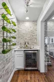a kitchen with a stove and a white cabinets