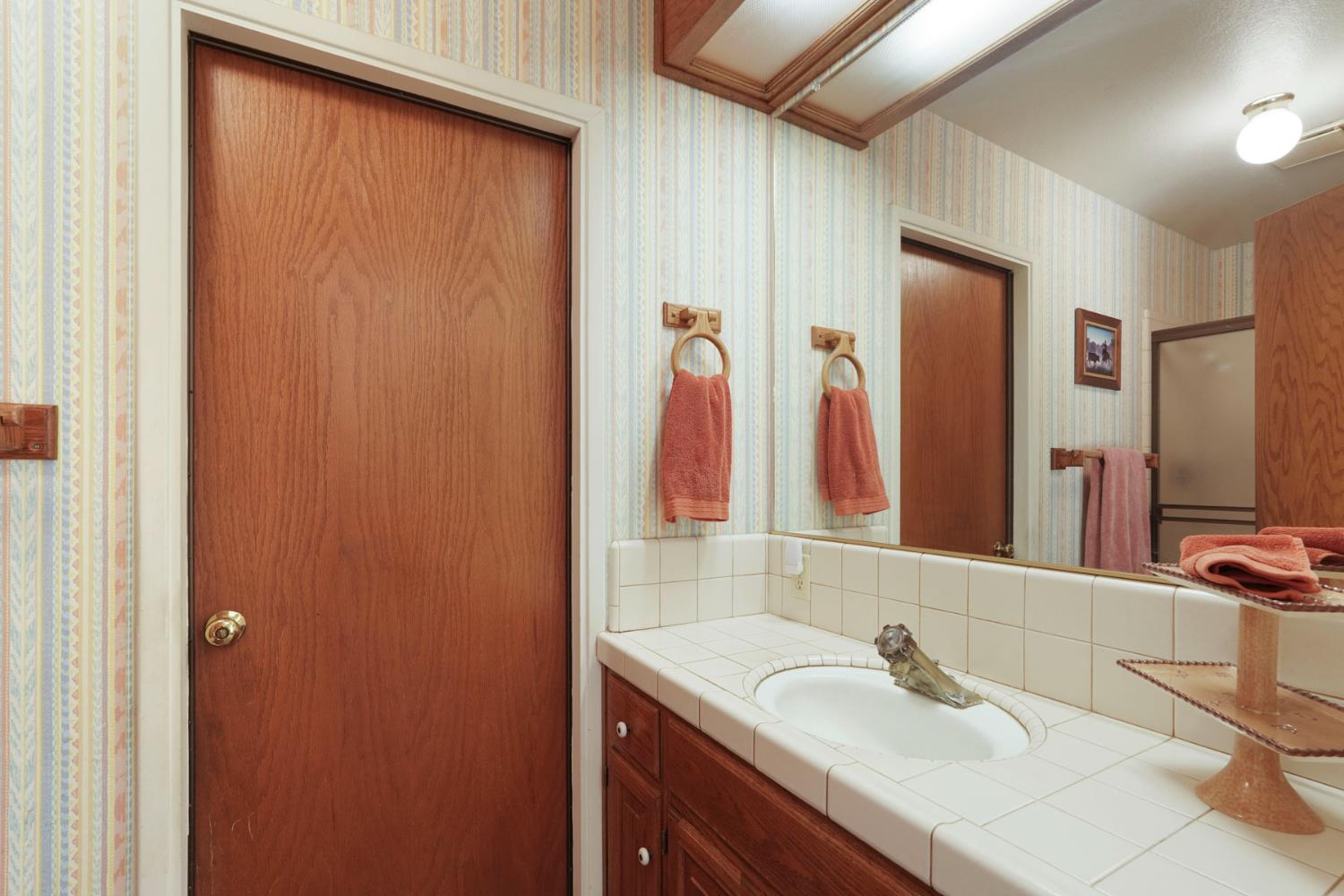 24606 Elliott Road Acampo, CA 95220 - Photo 44 of 73 Downstairs bathroom off the kitchen!