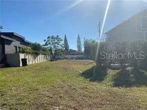 a view of outdoor space building and trees in the background