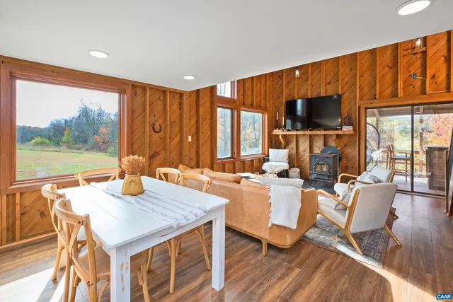 a view of a dining room with furniture window and outside view