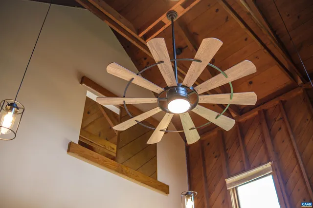 a room with gym equipment and wooden floor