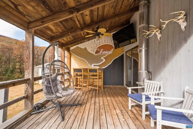 a view of balcony with wooden floor