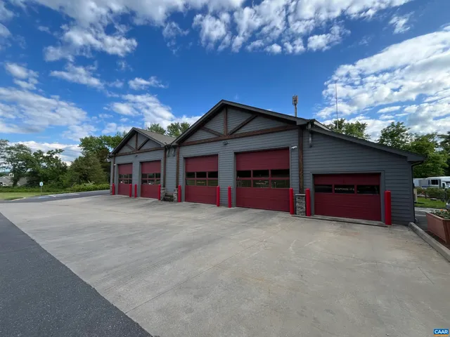 a front view of a house with yard and garage