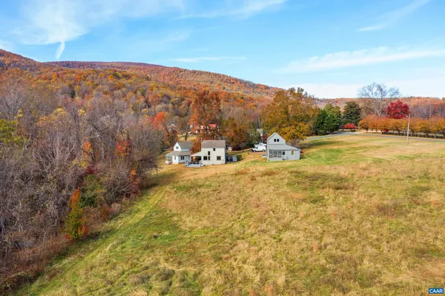 a view of a town with mountains in the background