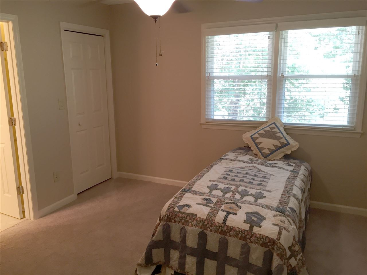 134 Timber Ridge Drive Durham, NC 27713 - Photo 23 of 25 Roomy second bedroom has great light, remote controlled lighted ceiling fan and generous walk in closet. Guest Bedroom