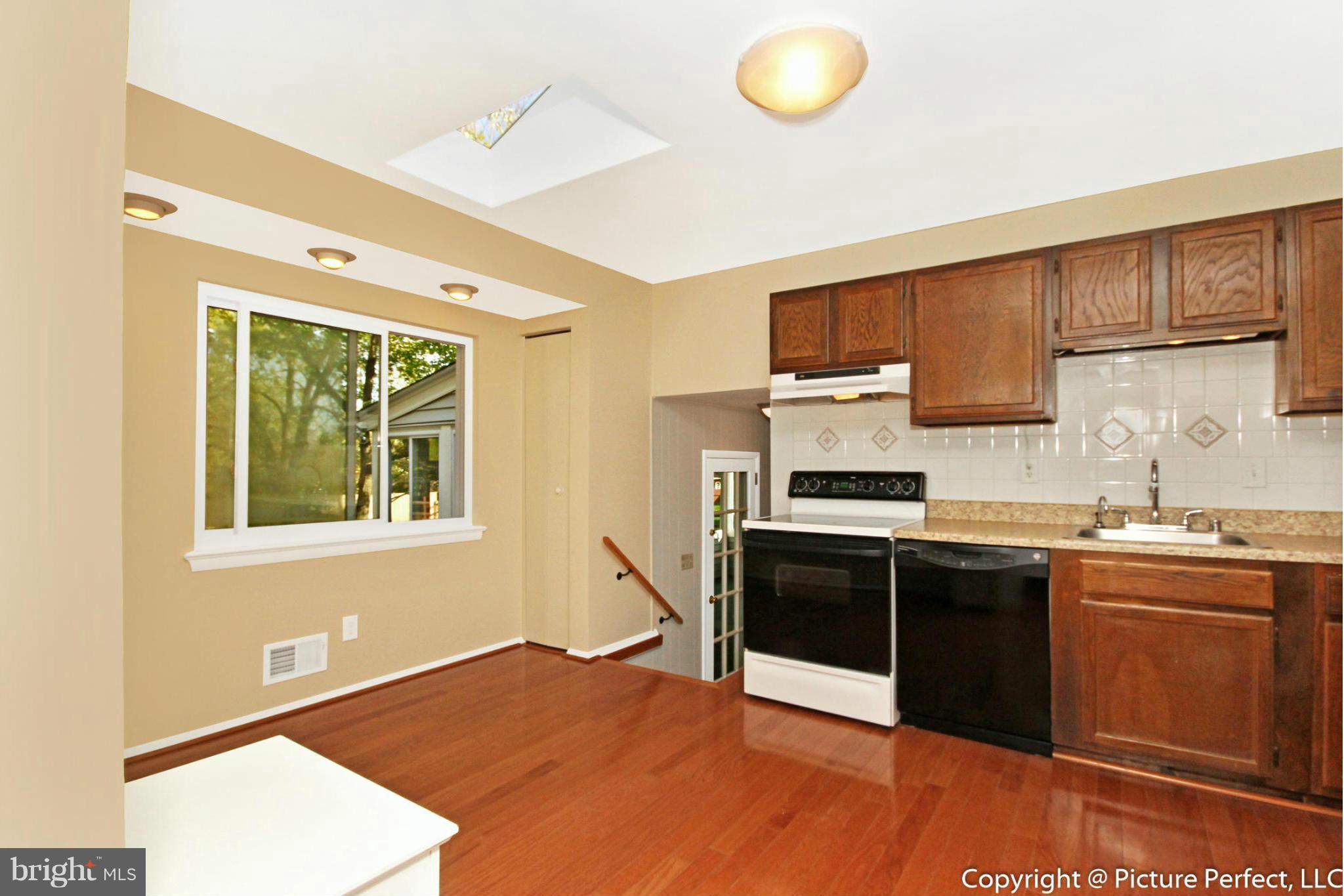 17117 Hoskinson Road Poolesville, MD 20837 - Photo 14 of 30 a kitchen with stainless steel appliances granite countertop a stove and a sink