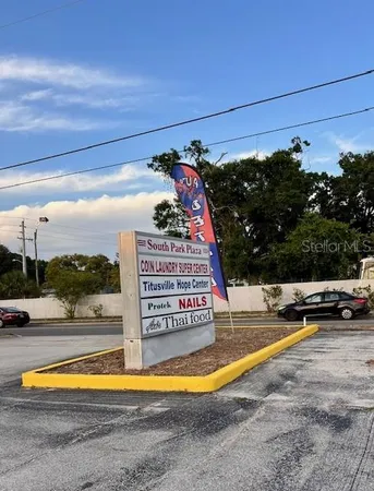 a view of swimming pool with a lounge chairs