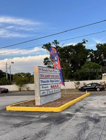 a view of swimming pool with a lounge chairs
