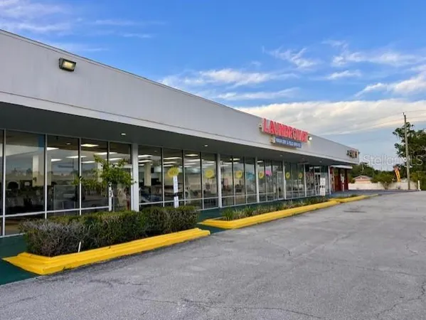 a view of swimming pool with an outdoor seating