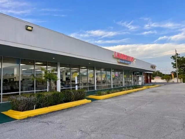 a view of swimming pool with an outdoor seating