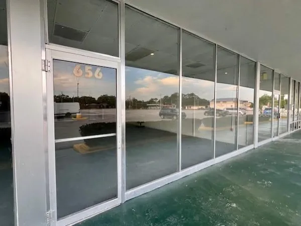 a view of a big room with windows