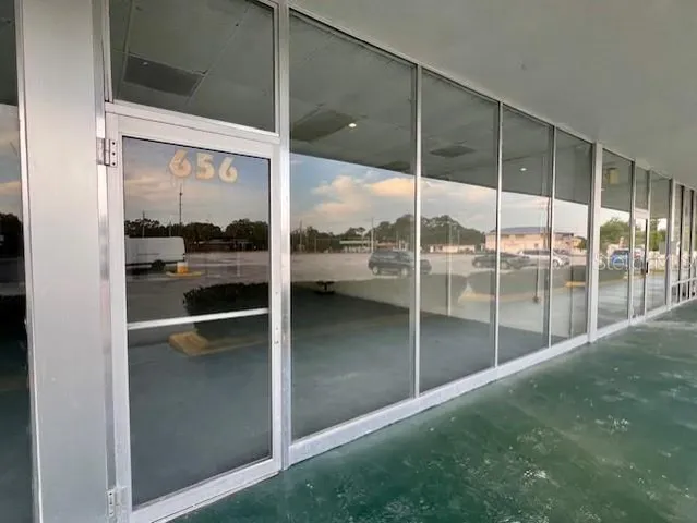 a view of a big room with windows