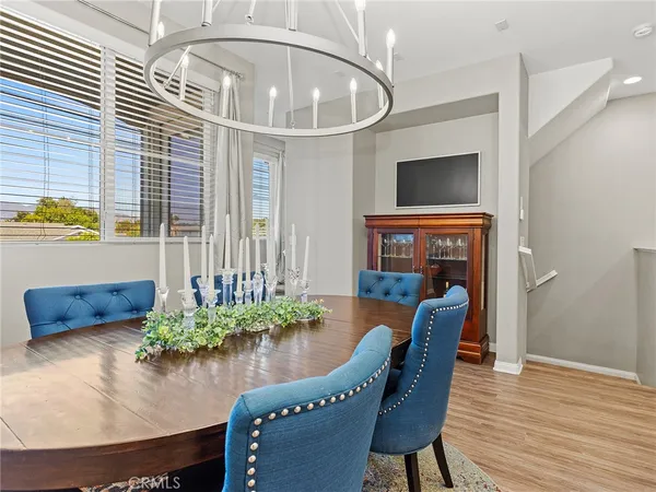 a dining room with furniture and wooden floor