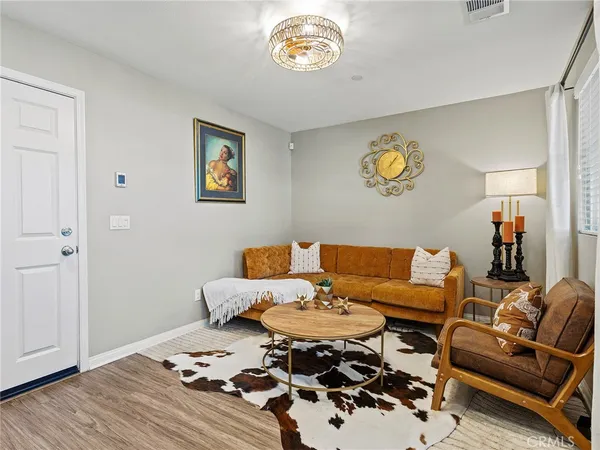a living room with furniture and a table