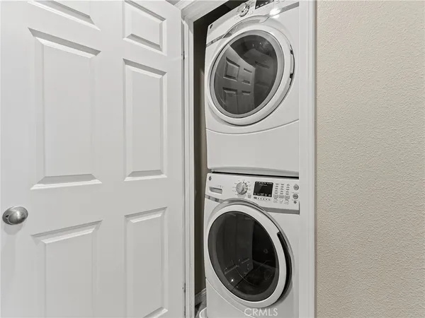 a close up view of a washer and dryer in a utility room