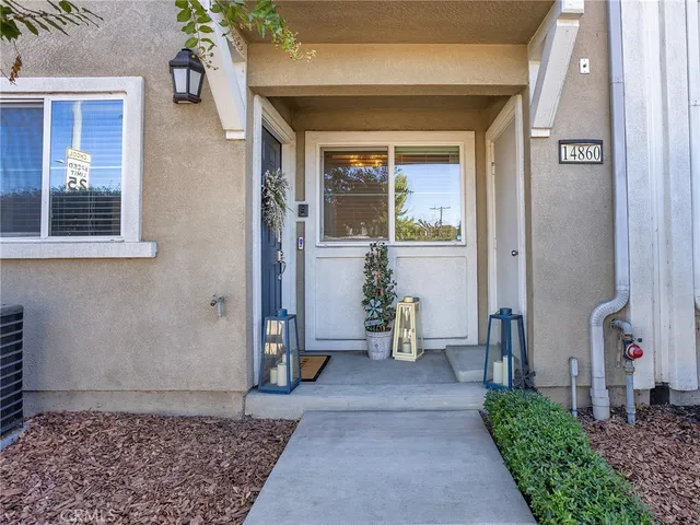 a view of an entryway with a table and chairs