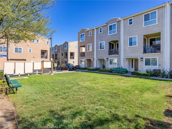 a large building with a yard in front of it
