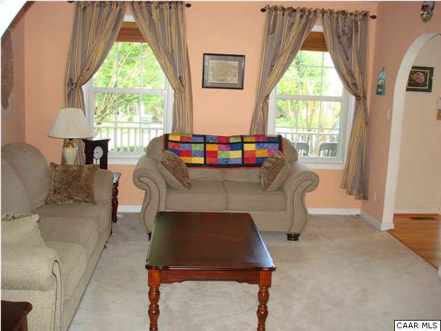 244 Starcrest Road Charlottesville, VA 22902 - Photo 2 of 17 a living room with furniture a window and a table