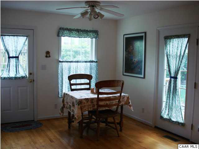 244 Starcrest Road Charlottesville, VA 22902 - Photo 5 of 17 a view of a workspace with furniture and a window