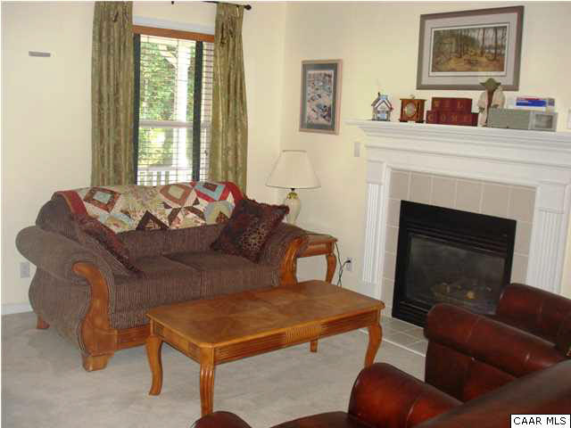 244 Starcrest Road Charlottesville, VA 22902 - Photo 9 of 17 a living room with furniture and a fireplace