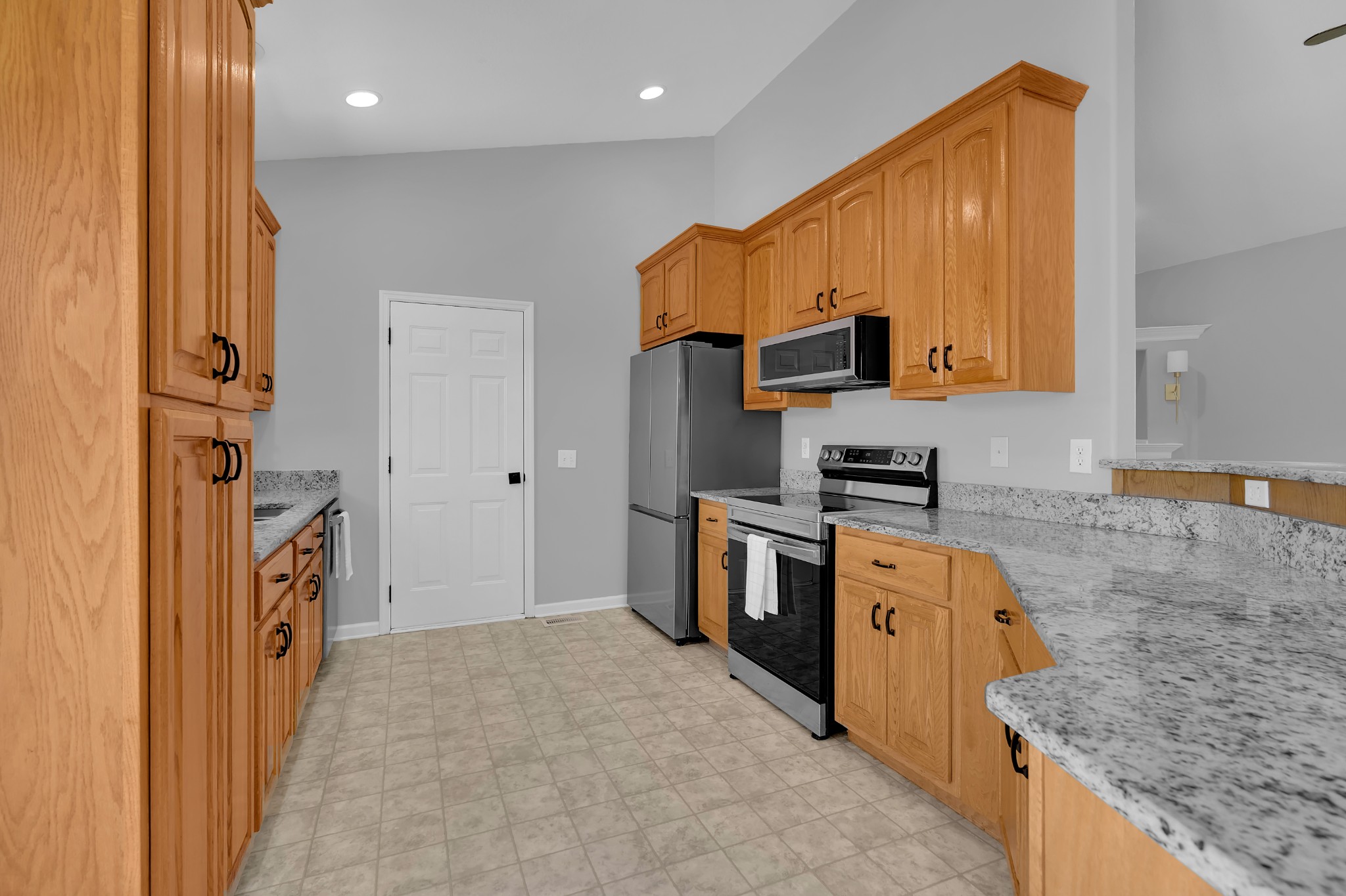 3896 Lynchburg Road Winchester, TN 37398 - Photo 14 of 57 a kitchen that has a sink a stove top oven a counter top space and cabinets