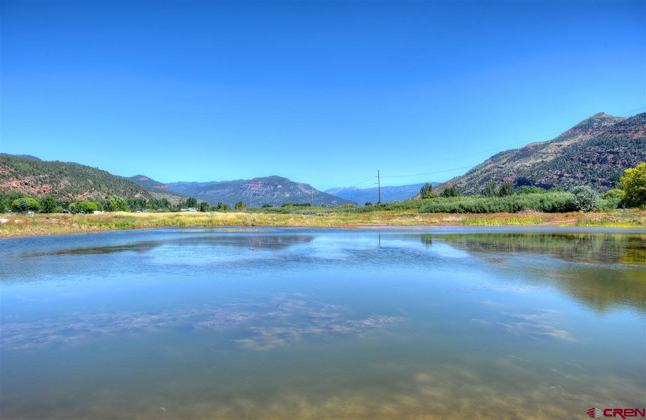 108 Twilight Trails Circle Durango, CO 81301 - Photo 11 of 12 a view of a lake with houses in the background