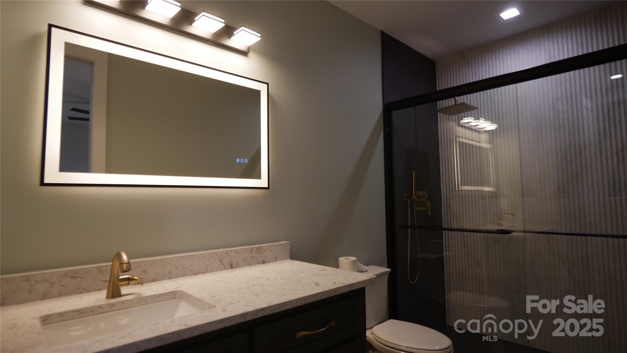 0 Concord Highway Monroe, NC 28112 - Photo 11 of 20 a bathroom with a sink toilet and mirror