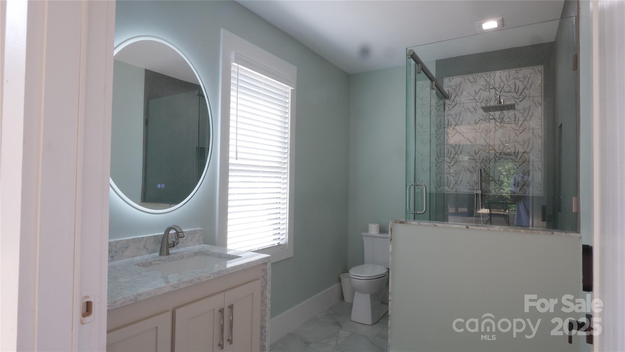 0 Concord Highway Monroe, NC 28112 - Photo 12 of 20 a bathroom with a toilet a sink and mirror
