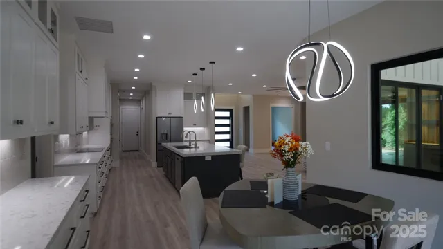 a dining room with furniture and a mirror