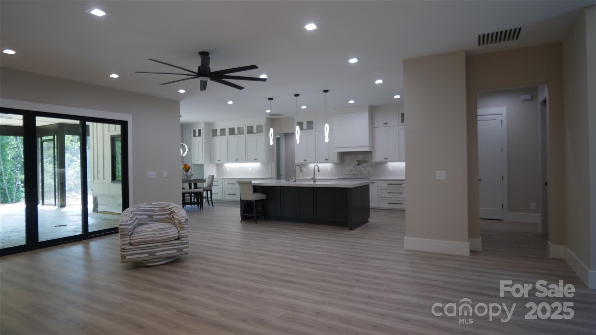 0 Concord Highway Monroe, NC 28112 - Photo 6 of 20 a living room with furniture and a chandelier