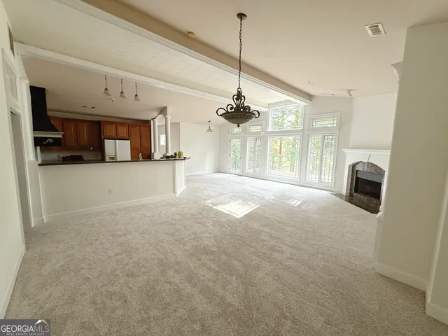 a view of a kitchen with a sink and a window