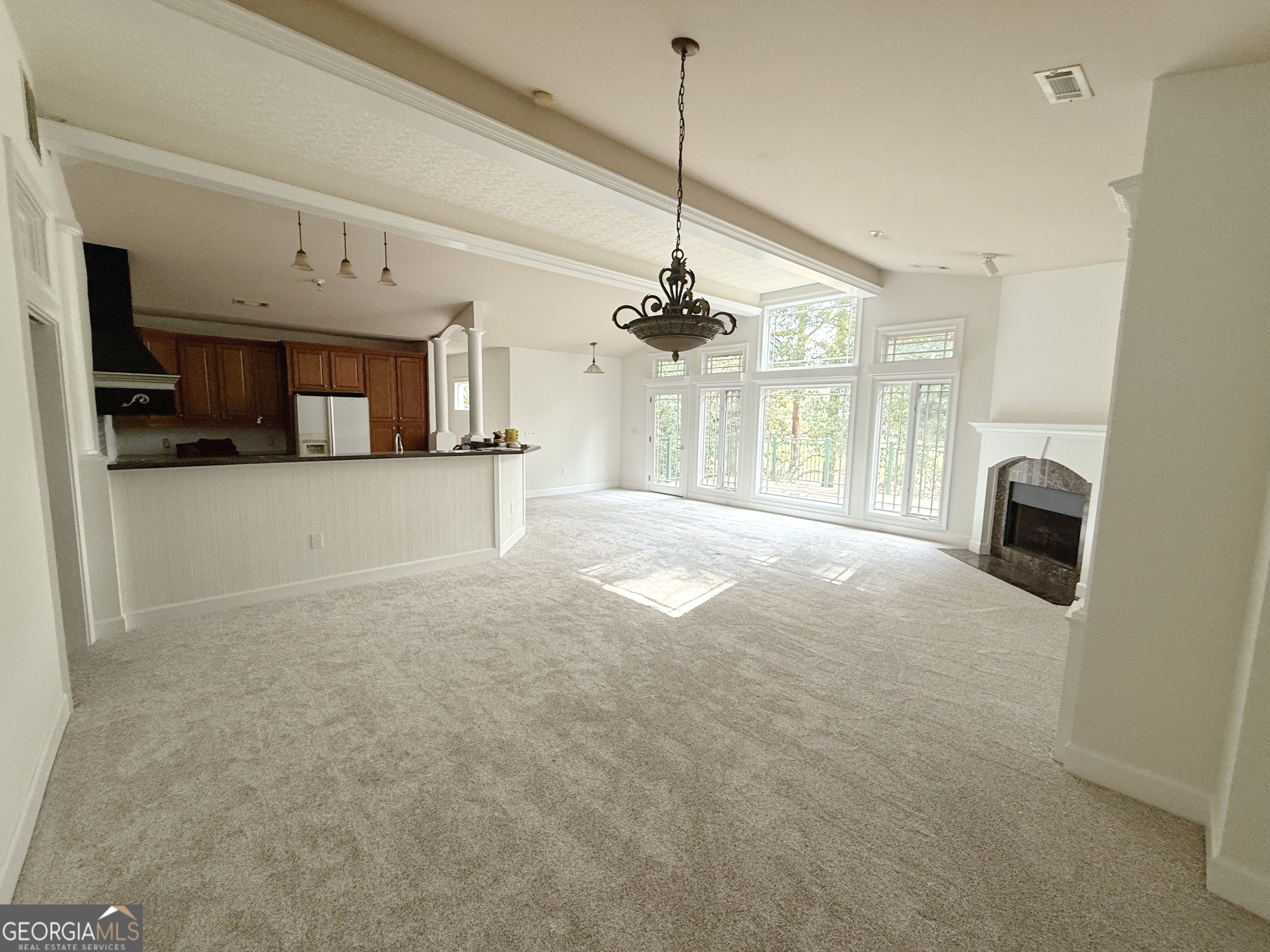 a view of a kitchen with a sink and a window
