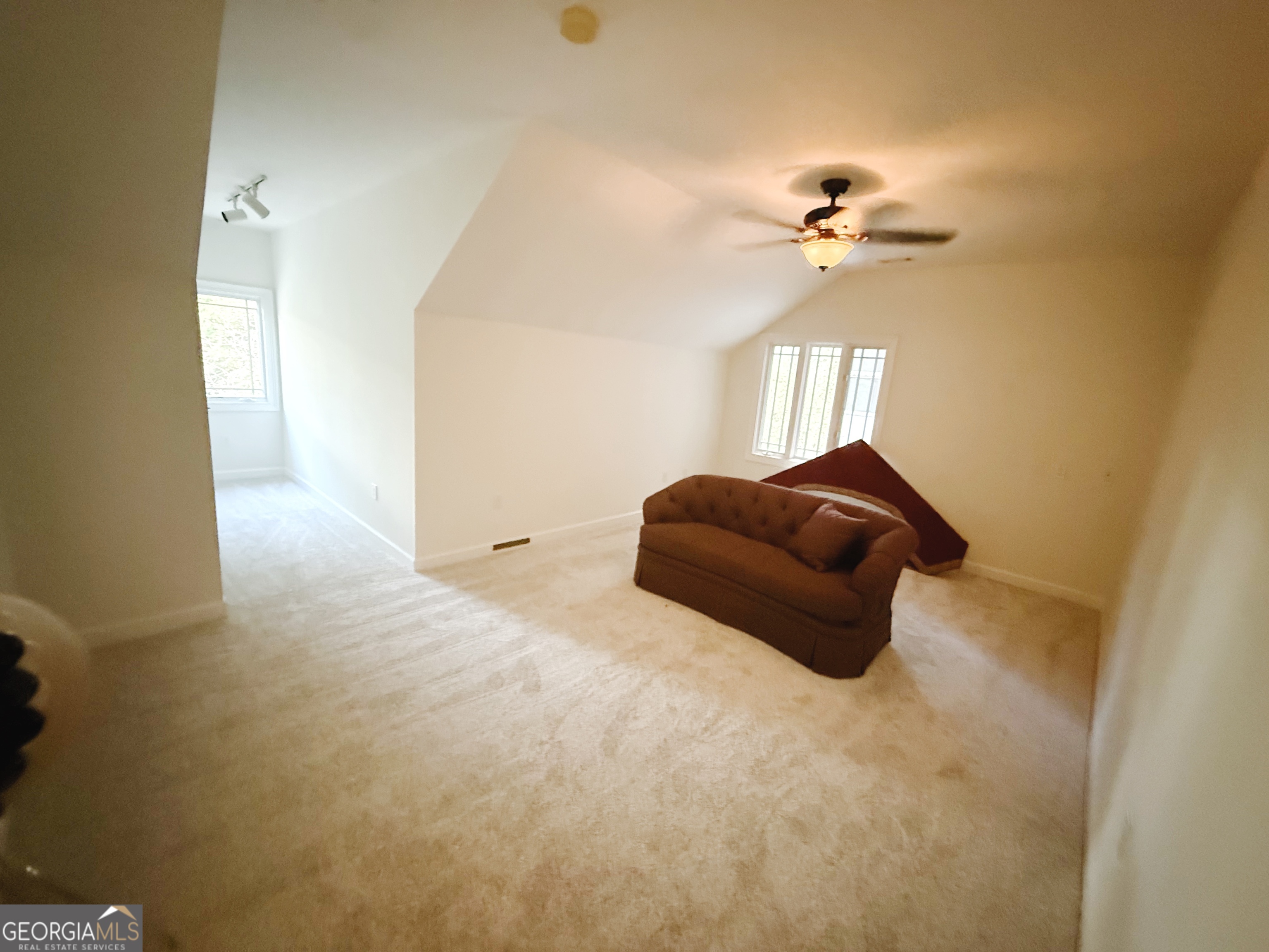 1235 Robinson Road Peachtree City, GA 30269 - Photo 3 of 9 a living room with furniture and a chandelier