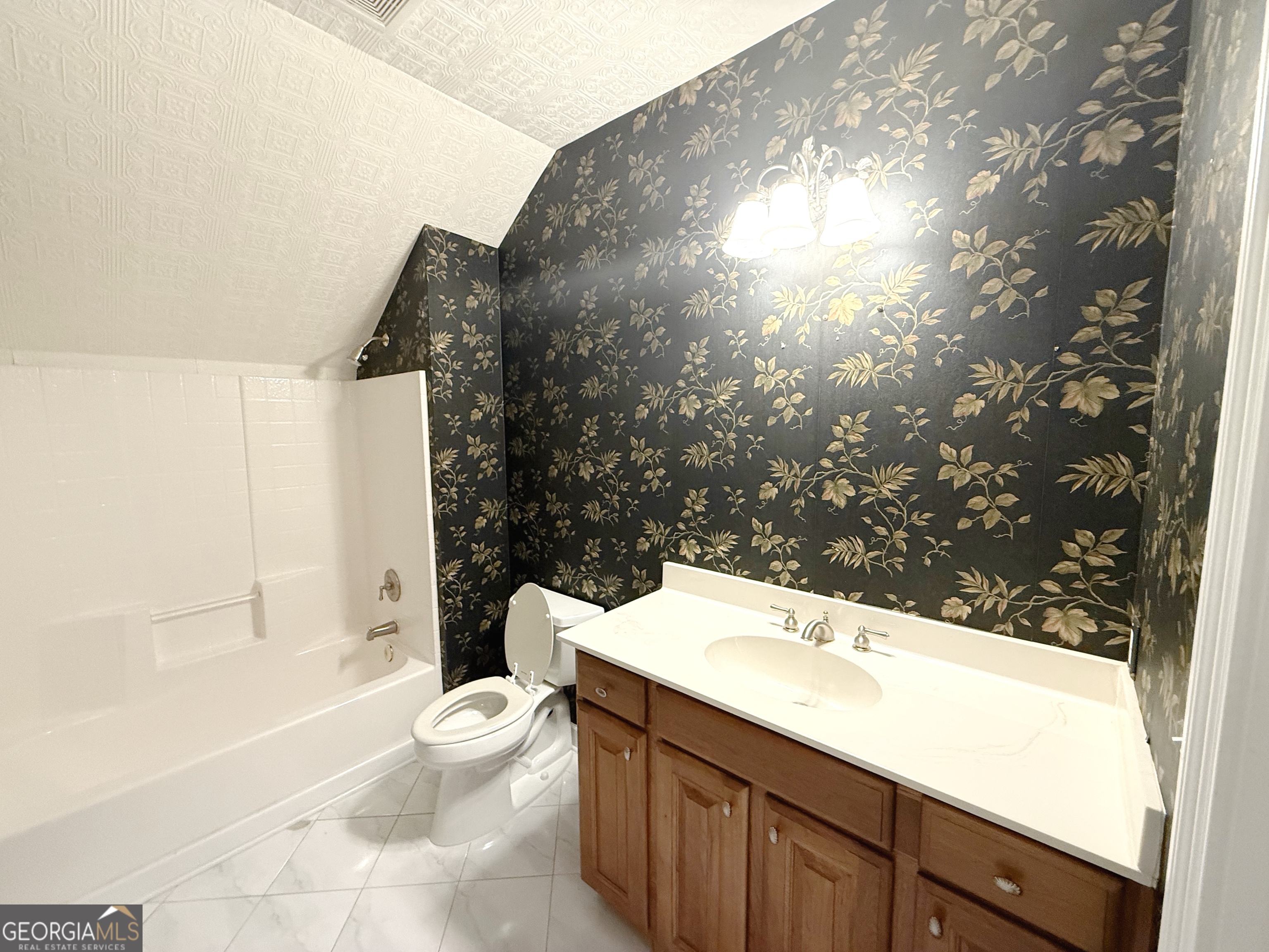 1235 Robinson Road Peachtree City, GA 30269 - Photo 6 of 9 a bathroom with a sink a toilet and shower