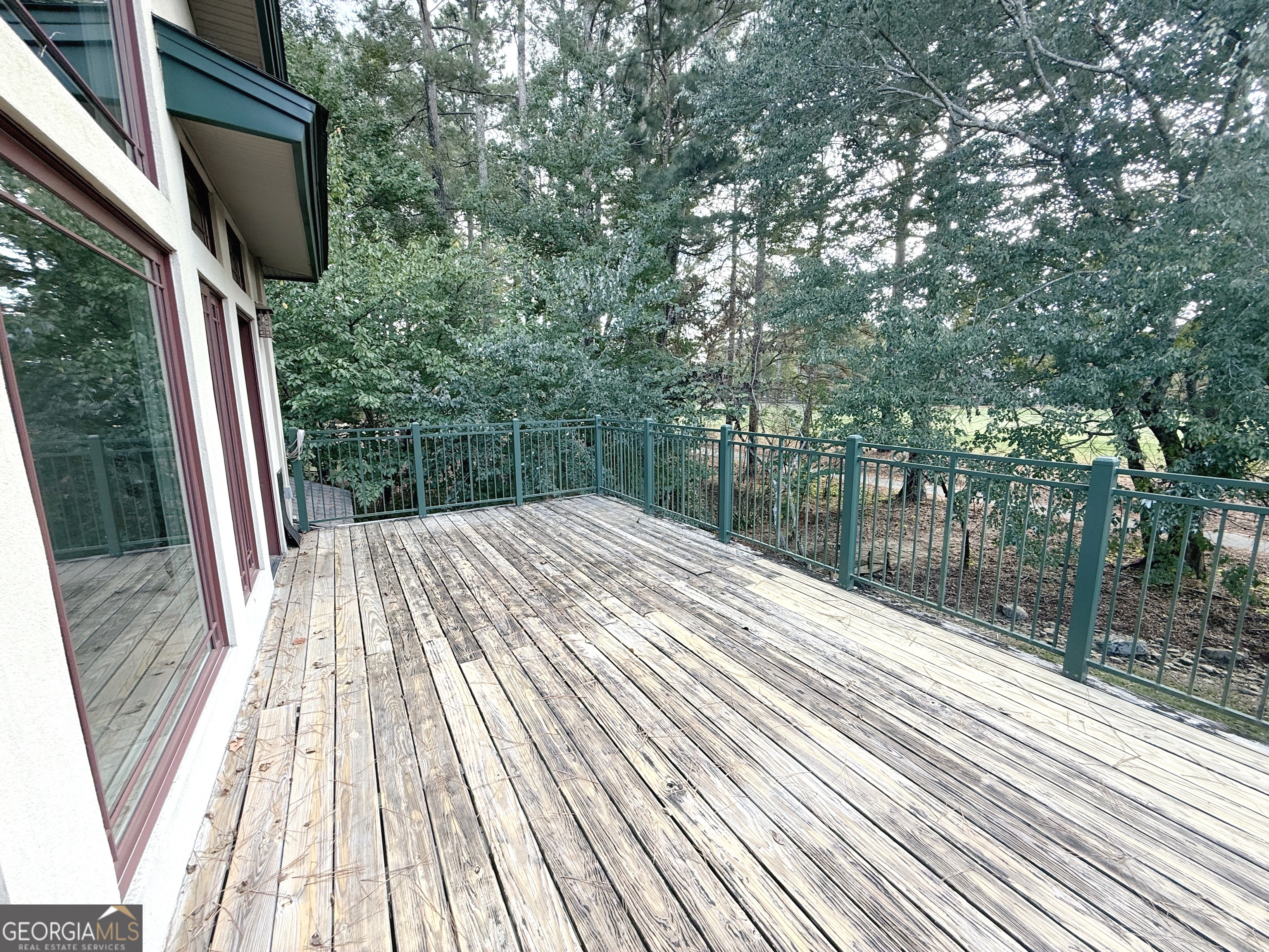 1235 Robinson Road Peachtree City, GA 30269 - Photo 9 of 9 a view of balcony with wooden floor and fence