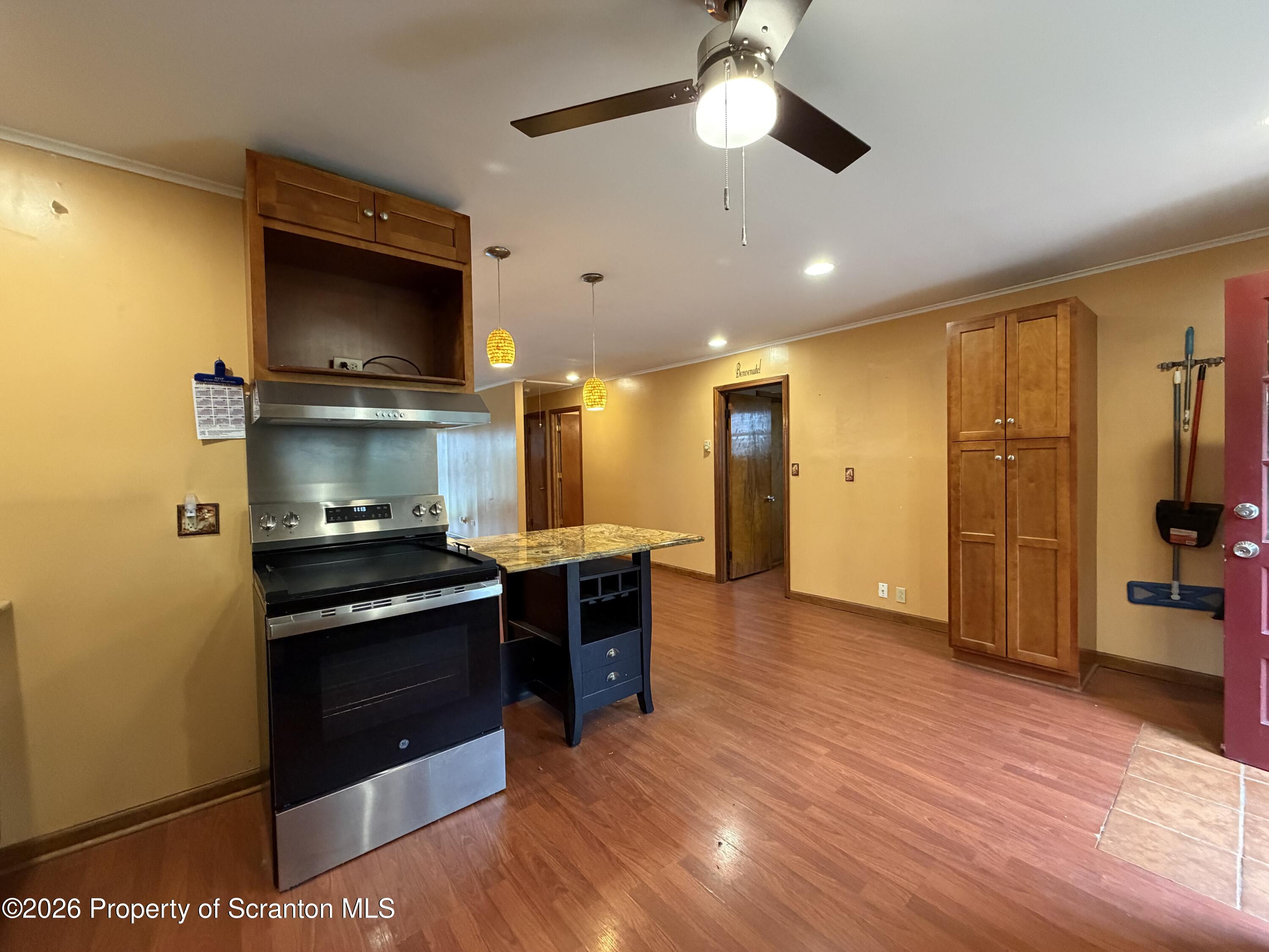 1019 Moosic Street Scranton, PA 18505 - Photo 17 of 43 a kitchen with stainless steel appliances granite countertop a stove and a refrigerator
