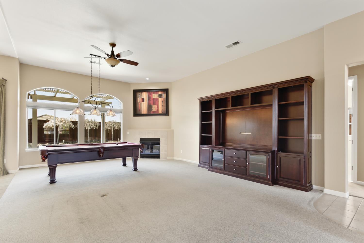702 Shakeley Lane Ione, CA 95640 - Photo 19 of 71 a living room with furniture and a flat screen tv