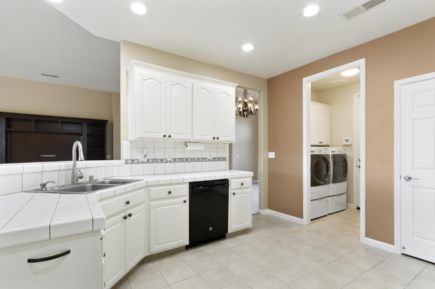 702 Shakeley Lane Ione, CA 95640 - Photo 29 of 71 a spacious bathroom with a granite countertop sink and a mirror
